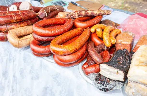 Selling smoked homemade meats, sausage and lard at the farmer's market