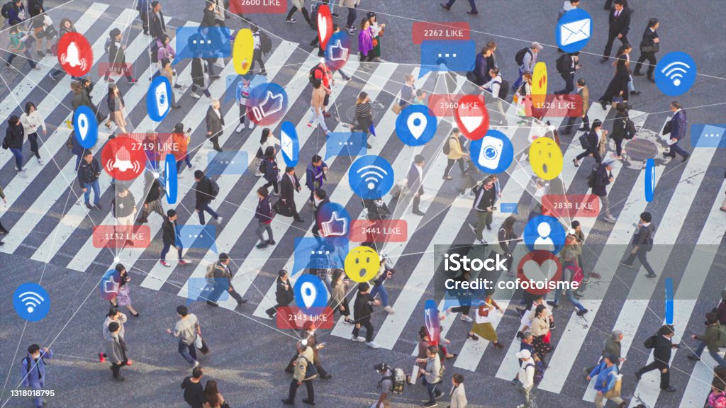 Communication technology and social media networking with people 4k resolution Social Media Signs, Symbols and Emojis connect with crowded people across intersection, futuristic technology design with people lifestyle Social Media Stock Photo