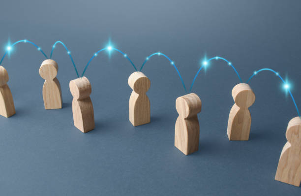 istock People are connected by a chain of connections. Communication and information transfer. Cooperation, collaboration. Production chain, customers and contractors. Beneficiaries. Economics and barter. 1318019016