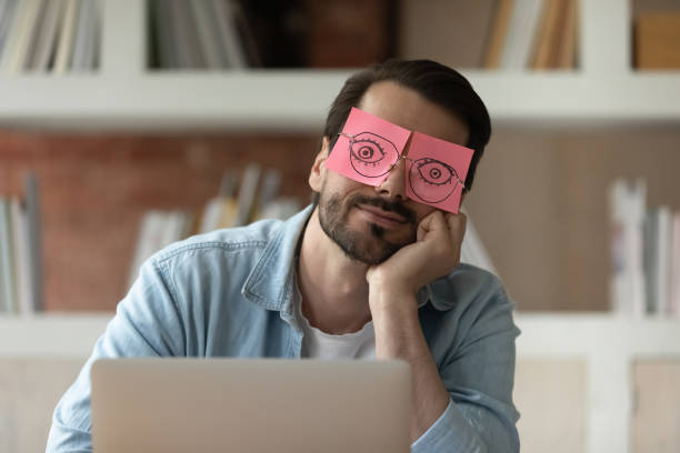 istock Close up tired businessman with stickers on eyes sleeping 1318021885