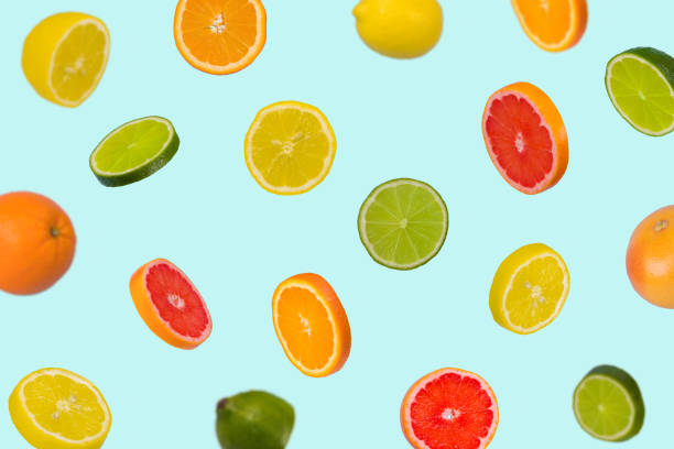 istock Minimal idea with fresh orange, lemon, lime and grapefruit sliced on pastel blue background. 1318025961