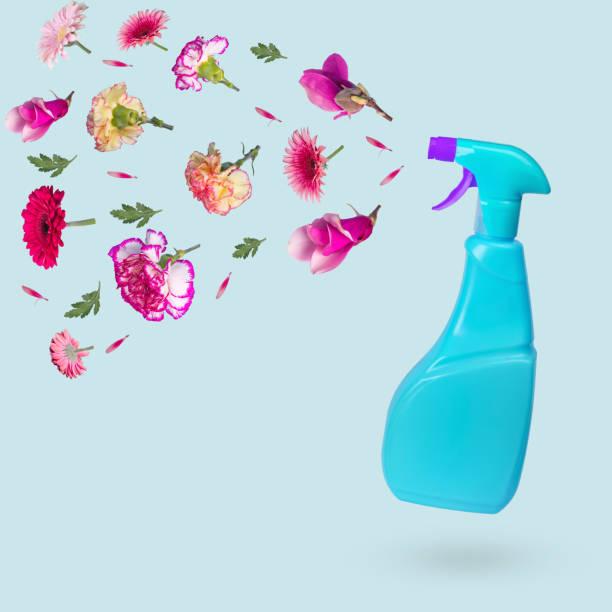 istock Creative idea made from a blue bottle with a spray and various flowers flying in the air. 1318027189