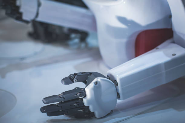 istock Hydraulic mechanical cyborg robot arm in hand shake gesture, robotized manipulator on  manufacture line 1318028908