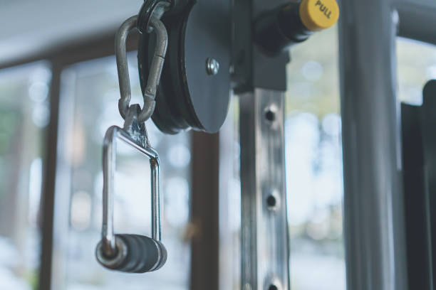 istock Cable curl exercise - close-up in health club 1318029337