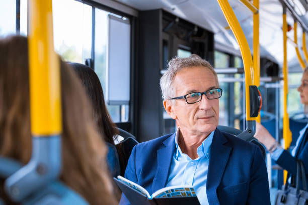 istock Senior businessman commuting in bus 1318030033