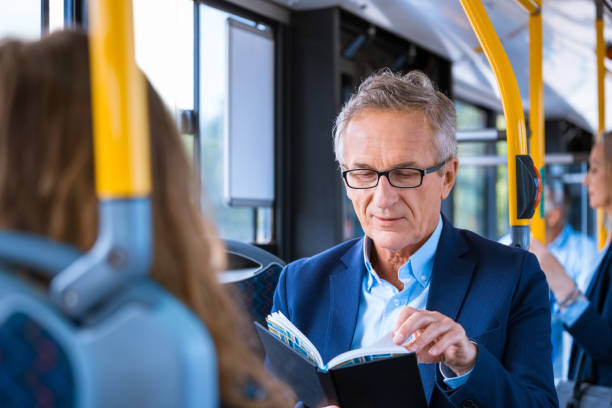 istock Elderly businessman traveling in bus 1318030090