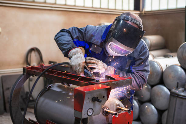 istock Worker is welding metal tubes, man hand welding boiler with argon gas 1318030176