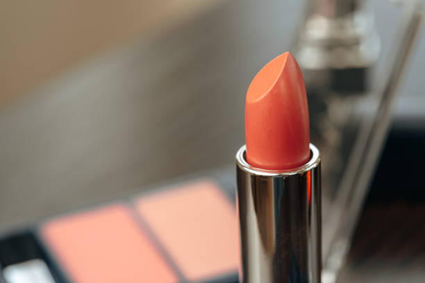 istock Pink lipstick on vanity table close up 1318036588