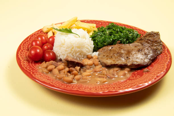 istock typical Brazilian basic dish with rice, beans, steak, french fries, braised cabbage and tomato 1318039180