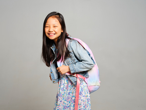 A studio portrait of an elementary school aged student.