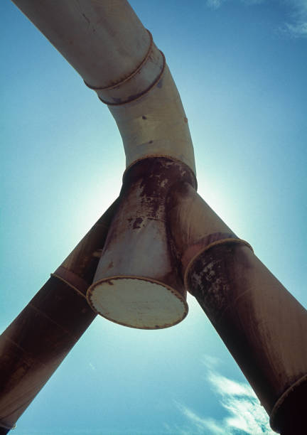 istock Pipes against blue sky at cement factory 1318046567