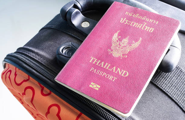 istock Thailand passport on Suitcase or luggage close up. 1318054702