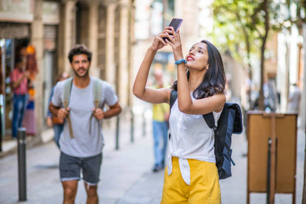 istock Energetic Couple Sightseeing with Smart Phone in Barcelona 1318055625