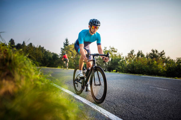 istock Young Cyclists Enjoying Morning Workout on Mountain Road 1318056906