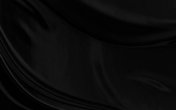 istock Black gray satin dark fabric texture luxurious shiny that is abstract silk cloth background with patterns soft waves blur beautiful. 1318057005