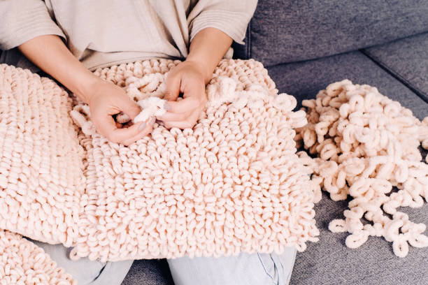 istock Knits made from thick soft yarn. Soft knitted cushions made of thick yarn. 1318058167
