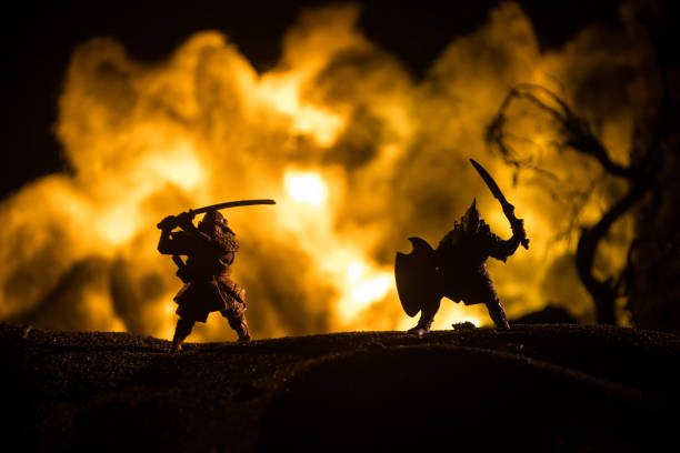istock Medieval battle scene with cavalry and infantry. Silhouettes of figures as separate objects, fight between warriors on dark toned foggy background with medieval castle. 1318058881