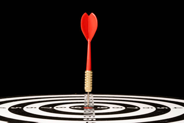 istock Red Dart arrow hit dartboard and goal on black background ,Setup objectives and target for business investment concept. 1318067787