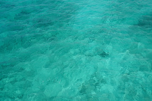 The surface of the clear blue sea