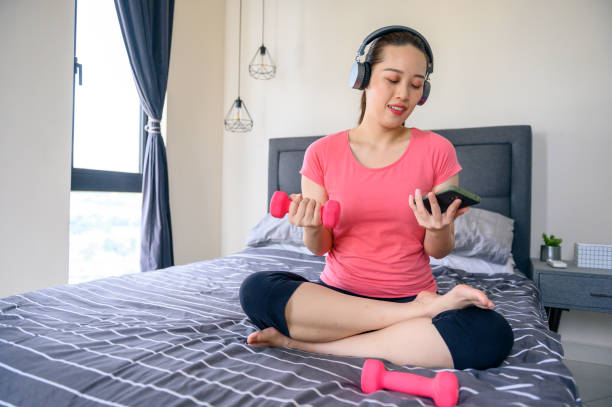 istock Asian woman learning online work out at home 1318069318