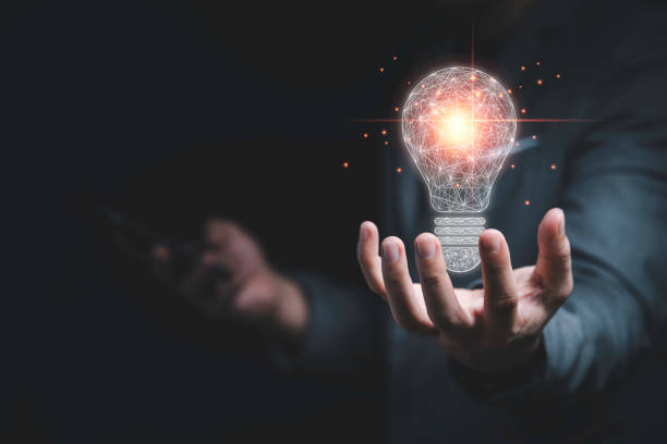 istock Businessman holding connection of light bulb with orange ray , Creative thinking idea and innovation concept. 1318070063