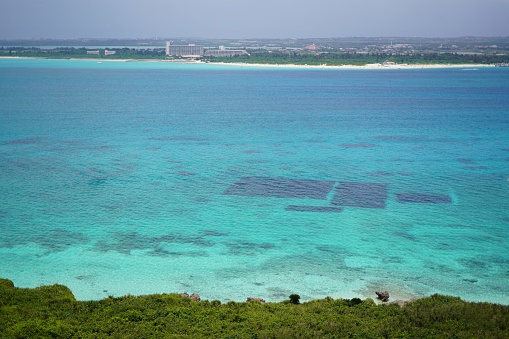 Emerald ocean and remote island in Okinawa