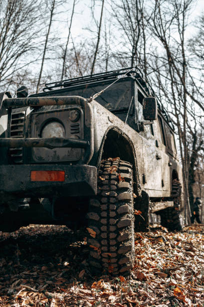 istock Dirty off road car on trip in forest 1318073426