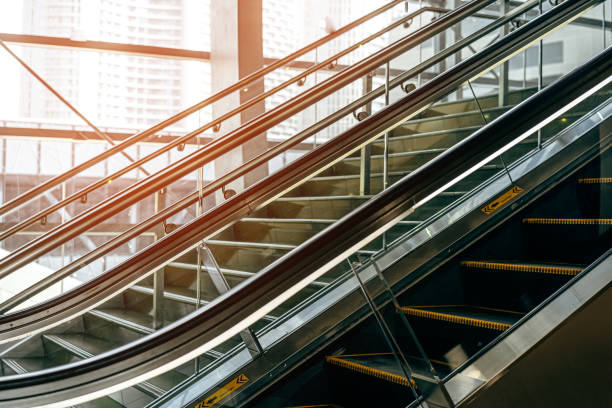 istock Interior of office center building with escalator 1318073472