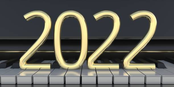 numero di capodanno 2022 sui tasti del pianoforte. illustrazione 3d - piano piano key orchestra close up foto e immagini stock