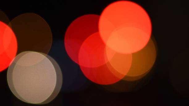 istock Bright red and orange colors bokeh lights in night darkness 1318085805