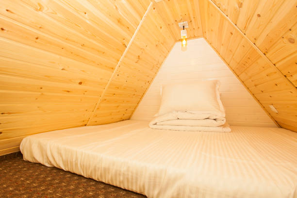 istock bed in small wooden house from the forest. 1318090223
