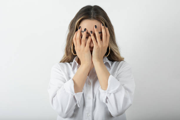 istock Young woman covering her eyes 1318090263