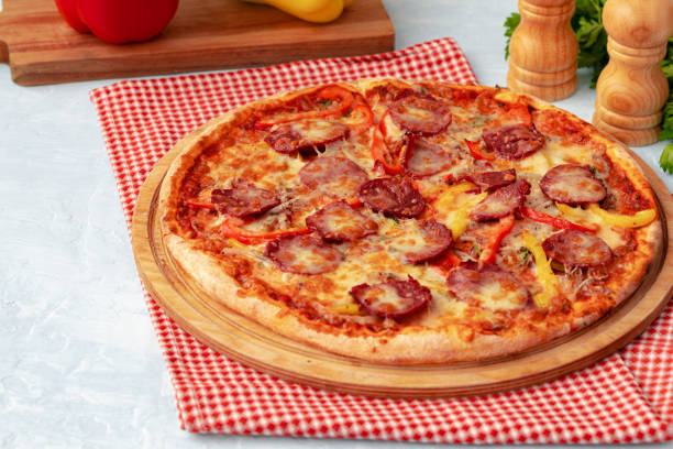 istock Freshly baked pizza on table close up 1318091987