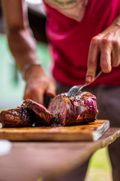 istock barbeque meat preparation in a summer day 1318092189