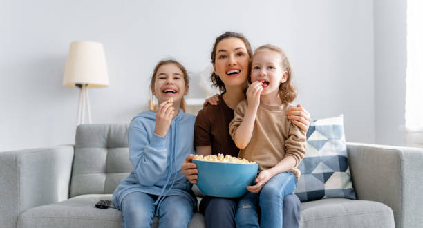 istock family watching TV 1318092227