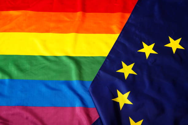 istock eu flag and Rainbow flags on the background 1318092251
