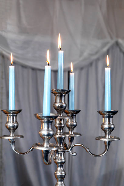 istock Blue candles and silver chandelier at a wedding 1318093397