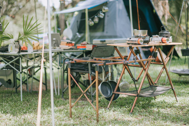 istock camping setup summer with tent, table, chair and guitar 1318093511