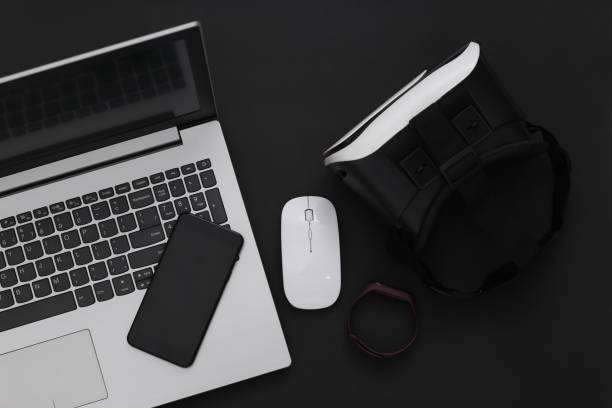 istock Modern youth gadgets and devices on a black background. Top view. Flat lay 1318094995
