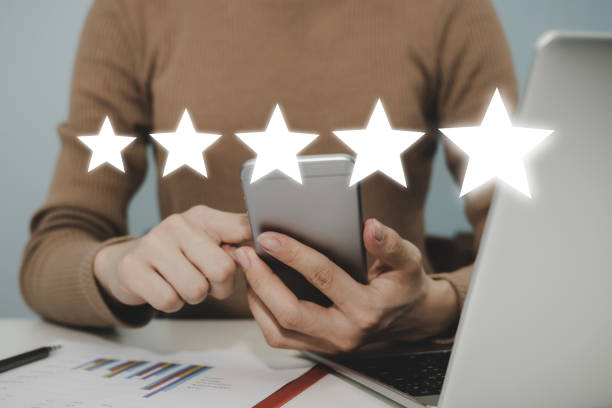 istock Excellent. woman hand working on mobile phone with five star rating button on visual screen to review good rating, digital marketing, good experience, positive thinking and customer feedback concept 1318095077