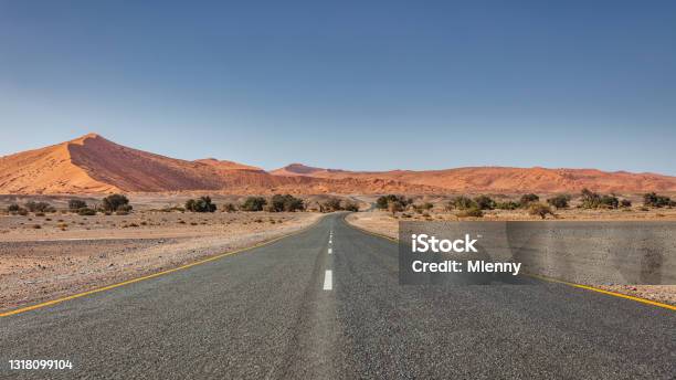 Lonely Empty Desert Road Through Sossusvlei Desert Landscape Namibia Stock Photo - Download Image Now