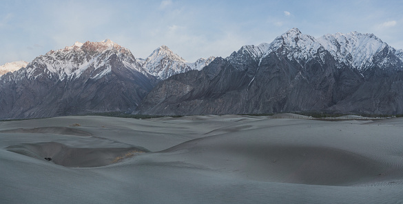Scenic view of Katpana Desert in Northern Pakistan on the background of Karakoram mountains