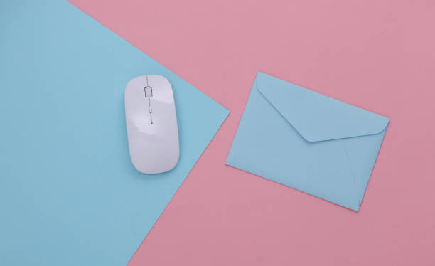 istock Online payment. PC mouse, envelope on pink blue pastel background. Top view. 1318101427