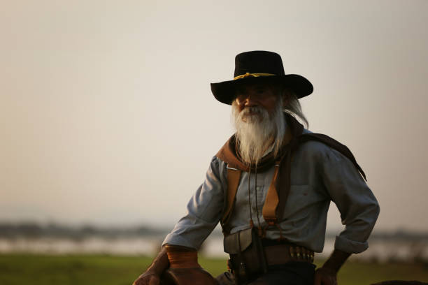istock Man Wearing Hat Standing On Land Against Sky 1318103010