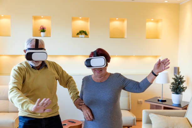 istock A Couple of Retirees is Gesturing and Smiling While Playing a Games on VR System. 1318107981