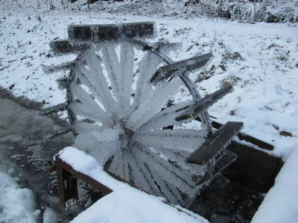 Icy millwheel in a park in Boskovice,Moravia,Czech republic,Europe