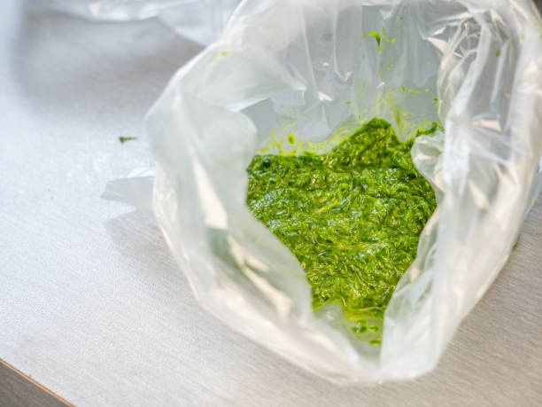 Ramson pesto in freezing bag. Chopped herbs with  ingredients for cooking stock photo