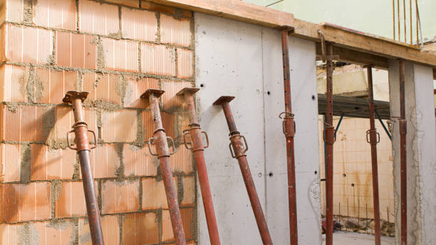 istock brick wall of a construction site with iron props and reinforced concrete 1318112794