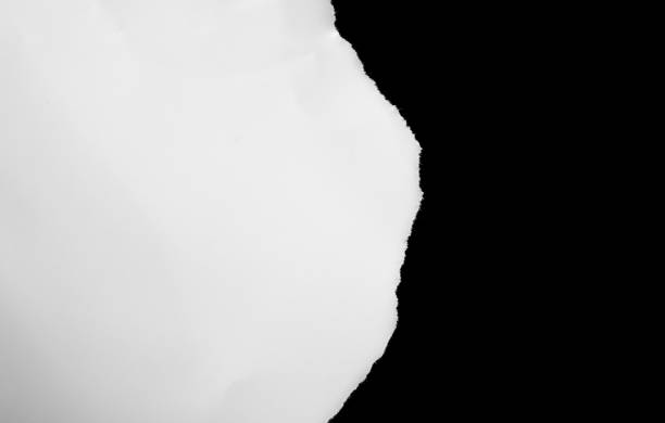 istock a white piece of paper on a black isolated background 1318113334