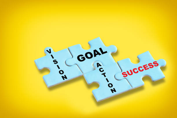 istock Vision goal action and success on blue puzzle on yellow background 1318114628